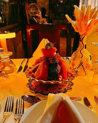 a plate of food sitting on a table at Riad Chay & Boutique in Ouarzazate