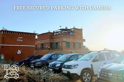 a group of cars parked in front of a building at Riad Chay & Boutique in Ouarzazate