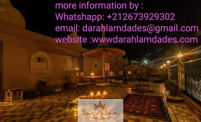 a picture of a patio at night with lights at Dar Ahlam Dades Hotel in Aït Ouaddar