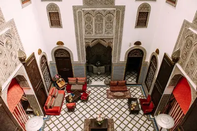 an overhead view of a mosque with chairs and tables at La Maison Bleue Batha in Fès