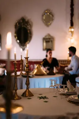 a table with candles on top of a table at La Maison Bleue Batha in Fès