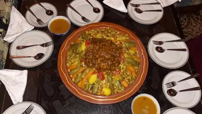a table with a plate of food on a table at Dar nadaa in Fès