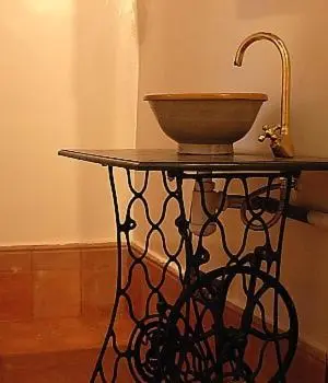 a table with a bowl on top of it at Kasbah Tigmi N'Oufella in Telouet