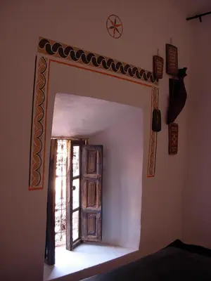 an open door in a room with a window at Kasbah Tigmi N'Oufella in Telouet