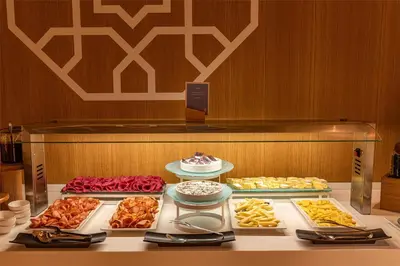 a display case with many different types of food at Barceló Fès Medina in Fès