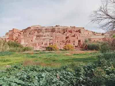 a large stone building on top of a mountain at Kasbah Imini Restaurant & Hotel in Taourirt