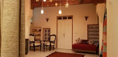 a living room with a table and chairs at Dar Zerhoune in Moulay Idriss Zerhoun