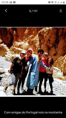 a group of people standing in front of a mountain at Riad pizzeria Marhaba in Akhendachou nʼAït Ouffi