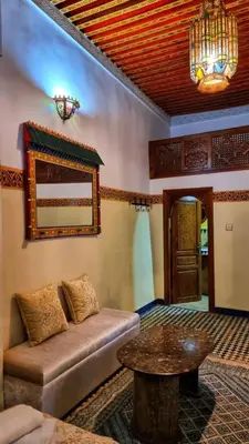 a living room with a couch and a table at Dar La Bague de Kenza in Fès