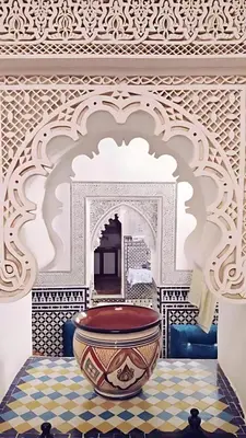 a room with a large bowl on a tiled floor at Riad Mounana fez 13th century luxury palace& spa in Fès