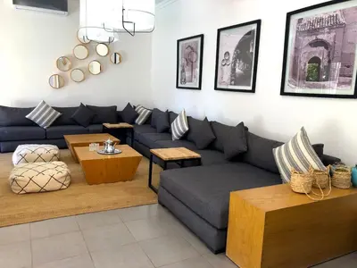 a living room with a couch and a table at Palais Akki in Marrakech