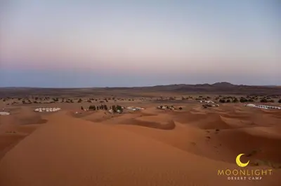 a view of a desert with a crescentresent at Moonlight Luxury Camp in Merzouga