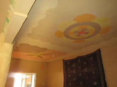 a room with a painting on the ceiling at Dounia Hostel in Tinerhir