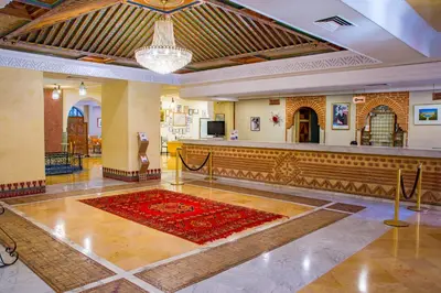 a large lobby with a red rug on the floor at Chems Le Tazarkount in Afourer