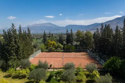 an overhead view of a tennis court with mountains in the background at Chems Le Tazarkount in Afourer