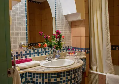 a bathroom with a sink with flowers on it at Chems Le Tazarkount in Afourer