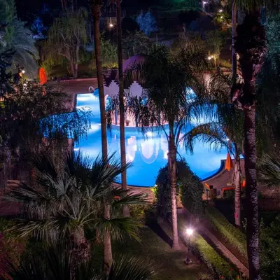 a view of a pool at night at Chems Le Tazarkount in Afourer