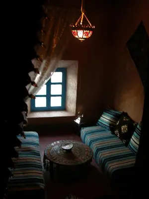 a living room with a couch and a table at Kasbah Iswan in Kalaat MGouna