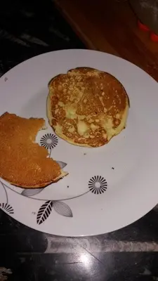 a white plate with two pancakes on it at Kasbah Iswan in Kalaat MGouna