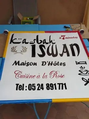 a sign for a lash is sau ak malcolm dirs cuisine at Kasbah Iswan in Kalaat MGouna