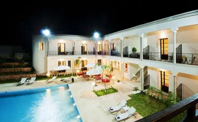 a villa with a swimming pool at night at Villa Agapanthe in Fès