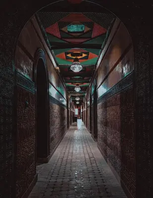 an alley way with a ceiling and a hallway with a tile floor at Hôtel LAKASBAH Ait Ben Haddou in Aït Ben Haddou