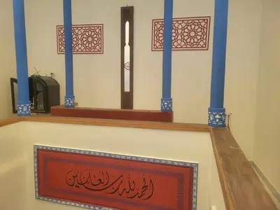a sign on the side of a room at Riad Dar Lemdrssa in Fès