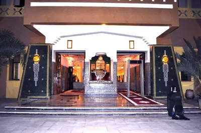 a lobby of a building with a door open at Erfoud Palace in Erfoud