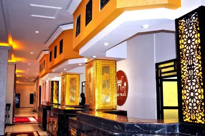 a store lobby with gold decorations on the walls at Erfoud Palace in Erfoud