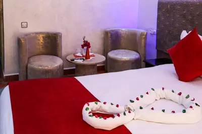 a hotel room with a bed with christmas decorations on it at Erfoud Palace in Erfoud