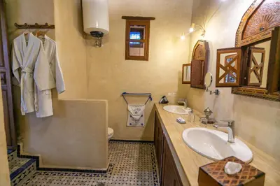 a bathroom with a sink and a toilet at Ryad Mabrouka in Fès