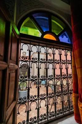 an iron gate with a window in a room at Dar El Yasmine in Fès