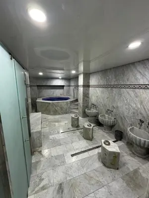a bathroom with two sinks and two toilets at Hotel Mounia in Fès