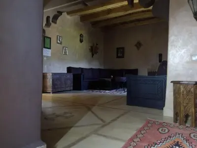 a large room with a living room with a fireplace at La Kasbah d'Ouzoud in Ouzoud