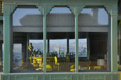 a view of a building with a person standing in the window at Palais Faraj Suites & Spa in Fès