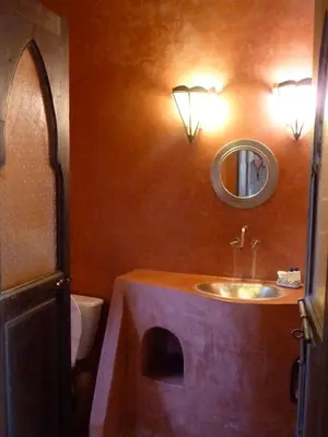 a bathroom with a sink and a mirror at Riad Cascades d'Ouzoud in Ouzoud