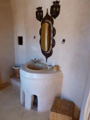 a bathroom with a sink and a mirror on the wall at Riad Cascades d'Ouzoud in Ouzoud
