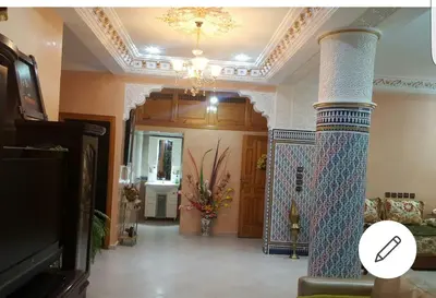 a living room with a column in the middle of a room at Beautiful & Comfortable Apartment in Fes in Fès
