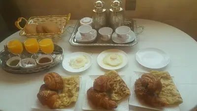 a table with a bunch of different types of breakfast foods at Beautiful & Comfortable Apartment in Fes in Fès