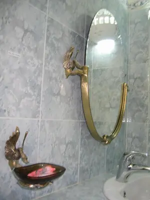 a bathroom with a mirror and a sink at Les Tourmalines in Ouarzazate