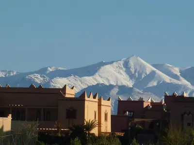 a mountain with snow covered mountains in the background at Les Tourmalines in Ouarzazate