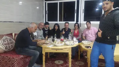 a group of people sitting around a table at Hotel Palace Zaida in Zaida