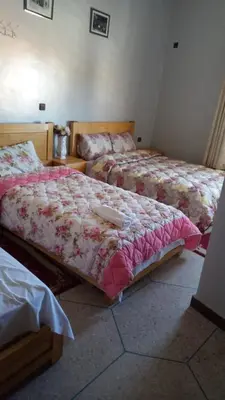 two beds in a room with two beds sidx sidx sidx at Hotel Palace Zaida in Zaida