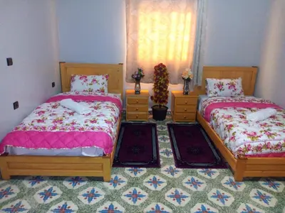 a bedroom with two beds and a window at Hotel Palace Zaida in Zaida