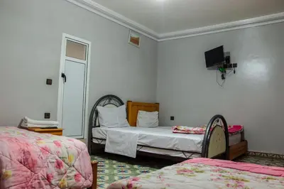 a bedroom with two beds and a tv on the wall at Hotel Palace Zaida in Zaida