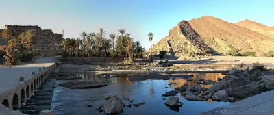 a pool of water in front of a pyramid at Amoudou Lodge Camp in Tissint