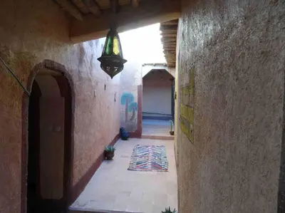 an alley with a light hanging from a building at Kasbah Omari in Tinerhir