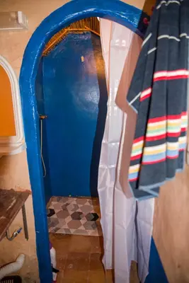 a room with a blue door and a floor at Kasbah Omari in Tinerhir