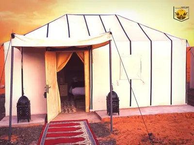a small greenhouse with a basketball hoop in it at Camel Trips Luxury Camp in Merzouga