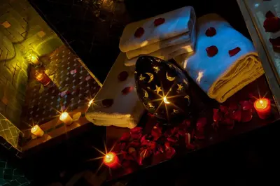 a cake and candles and lights on a table at Riad La Maison Verte in Fès